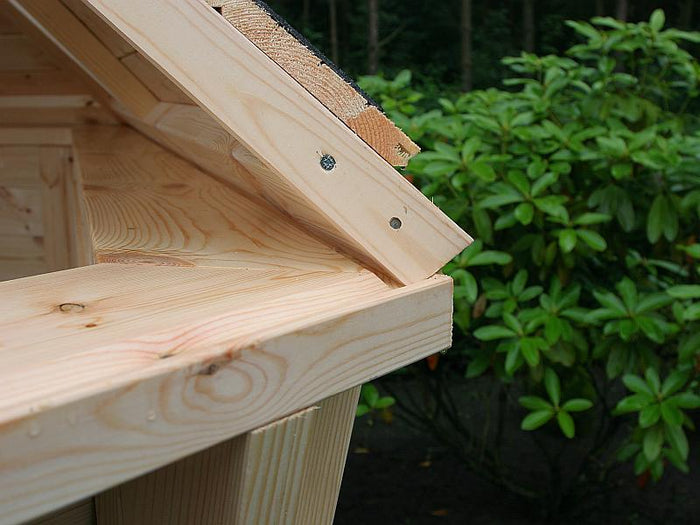 Wolff Finnhaus Grillkota Basic 9 mit Grillanlage schwarze Schindeln und rundem Tisch