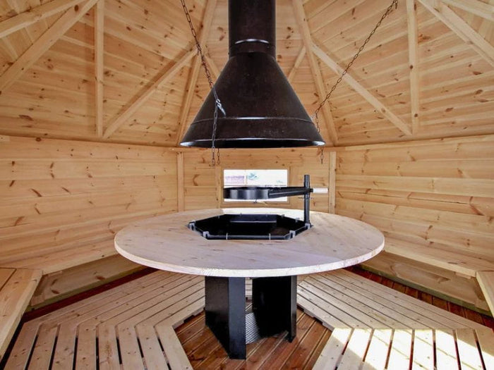 Wolff Finnhaus Grillkota Basic 9 mit Grillanlage schwarze Schindeln und rundem Tisch